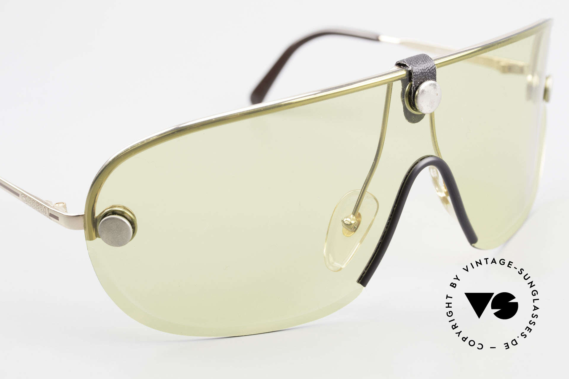 Carrera 5418 All Weather Sunglasses Polar, yellow lens wearable at dusk and bown lens at daytime, Made for Men