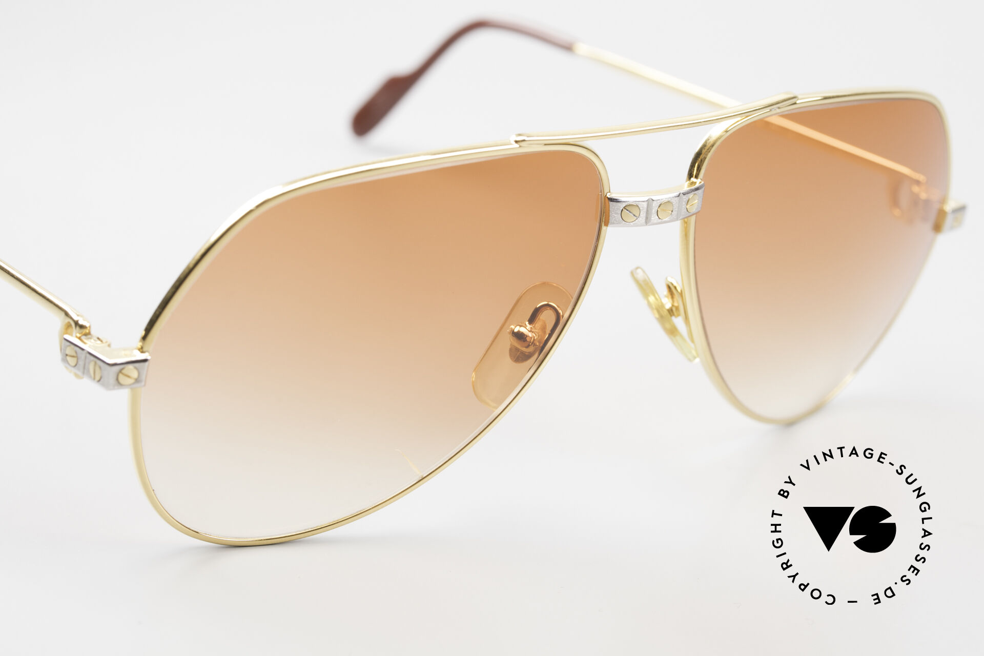 orange cartier glasses