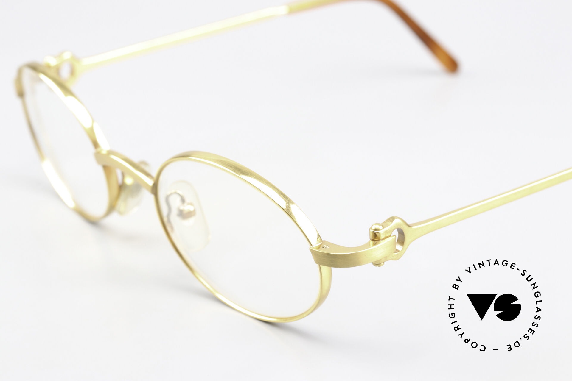 Cartier gold oval glasses hot sale