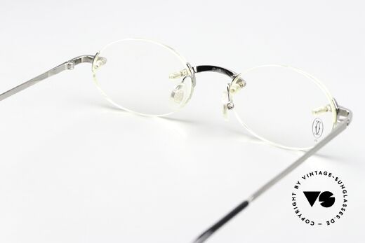 Cartier T-Eye Oval Titanium Frame Rimless, lens size (gliding lens) can be changed if needed, Made for Men and Women