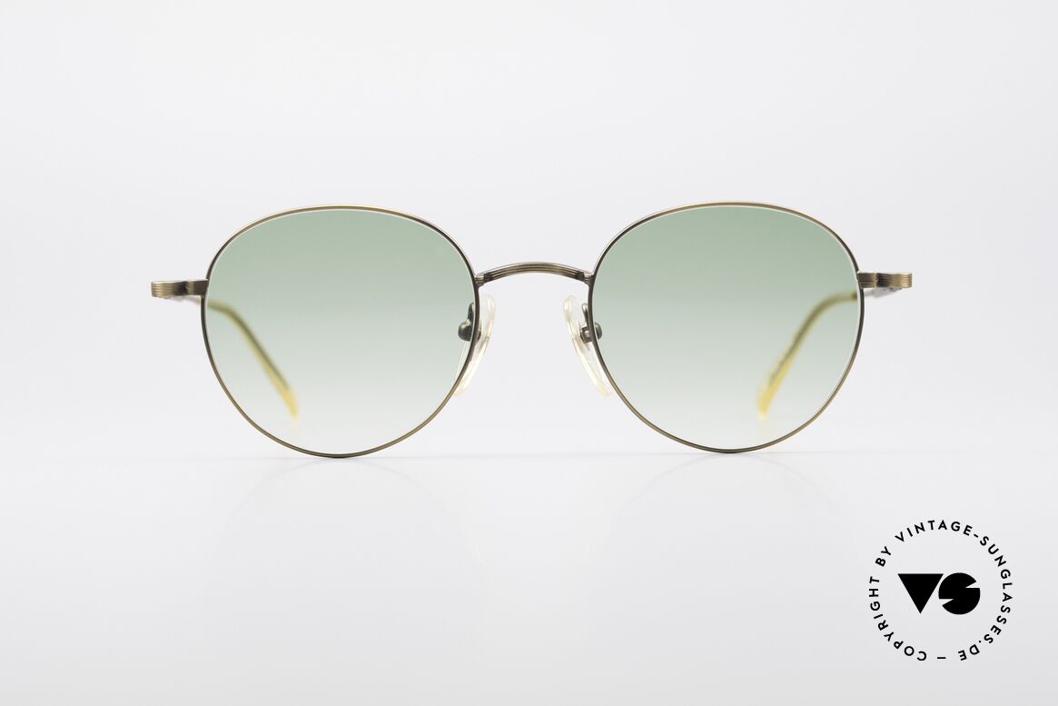 Jean Paul Gaultier 55-1174 Round Designer Sunglasses, costly, unique frame finish: METALLIC SMOKE GOLD, Made for Men and Women