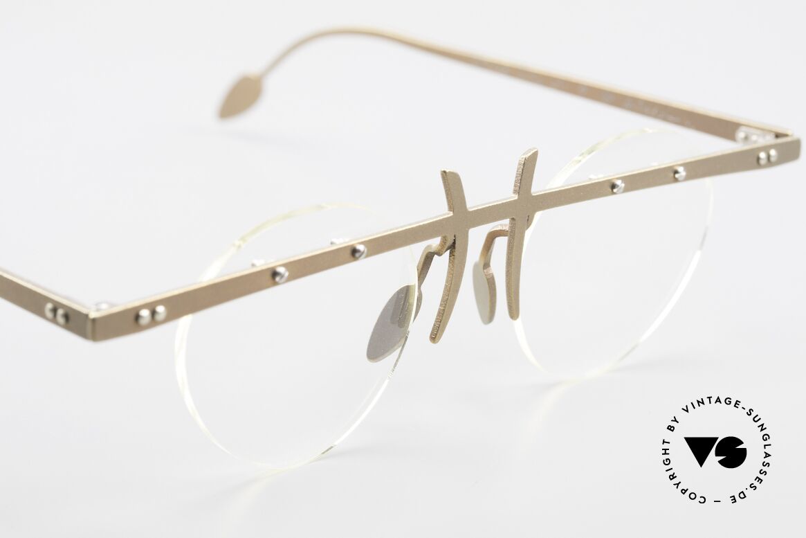 Theo Belgium Tita VI 9 Vintage Eyeglasses Titanium, the clear DEMO lenses are fixed with screws at the frame, Made for Men and Women