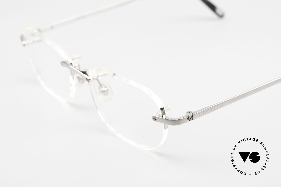 Cartier T-Eye Rimless Titanium Frame Rimless, titanium frame with brushed ruthenium finish, Made for Men and Women