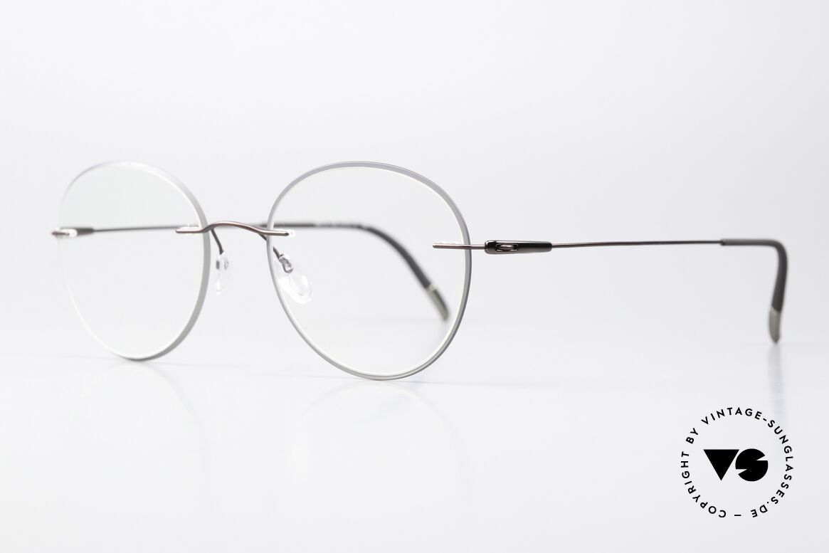 Silhouette 5500 Colorwave Core Accent Series, strikingly round rimless glasses with “acetate core”, Made for Men and Women