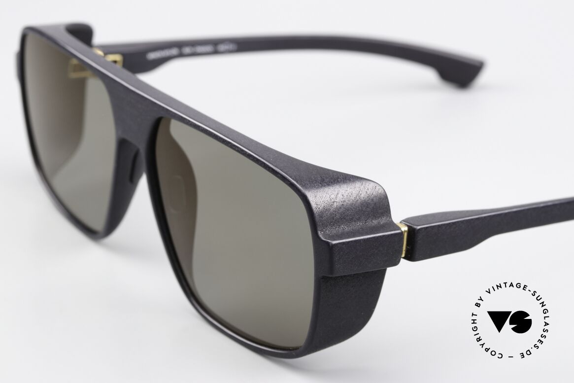Mykita Mylon Daggoo Pitch Black Lightgold Flash, slightly gold-mirrored sun lenses by ZEISS, Made for Men