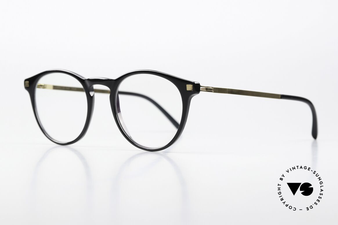 Mykita Talini Feminine Designer Specs, timeless color code 828 is called 'Black / Glossy Gold", Made for Women
