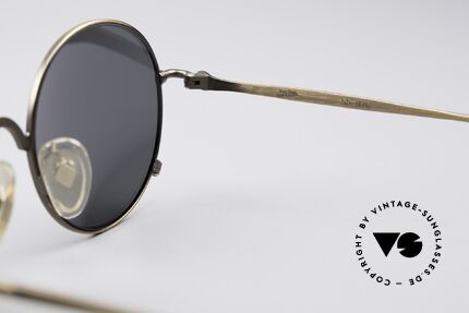 Jean Paul Gaultier 55-1176 Round Polarized Shades, dark gray polarized sun lenses; 100% UV protection, Made for Men and Women