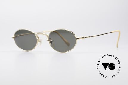 Jean Paul Gaultier 55-7106 Gold Plated Oval Sunglasses, with dark green sun lenses for 100% UV protection, Made for Men and Women