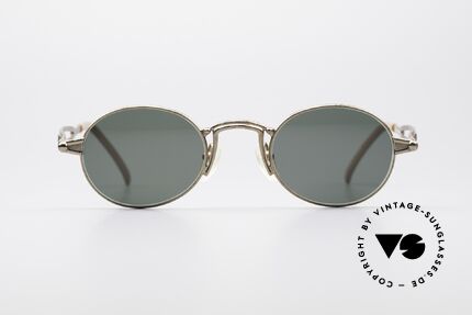 Jean Paul Gaultier 56-7108 Oval Designer Sunglasses, classic oval frame with striking designer details, Made for Men and Women