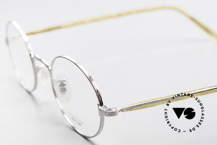 Oliver Peoples OP50V Oval 90's Eyeglasses Vintage, combined with the intellectual styling of the 1960's, Made for Men and Women