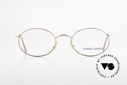 Giorgio Armani 131 Vintage Eyeglasses Oval Frame, interesting frame finish in a kind of bronze/copper, Made for Men and Women