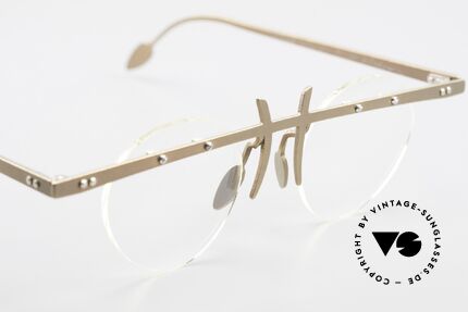 Theo Belgium Tita VI 9 Vintage Eyeglasses Titanium, the clear DEMO lenses are fixed with screws at the frame, Made for Men and Women