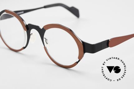 Theo Belgium Eye-Witness UC Ladies And Gents Eyewear, this UC model shines red metallic and black; TITANIUM, Made for Men and Women