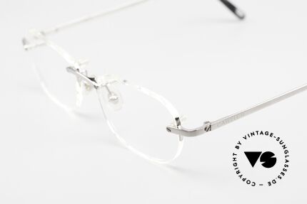 Cartier T-Eye Rimless Titanium Frame Rimless, titanium frame with brushed ruthenium finish, Made for Men and Women