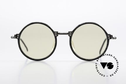 Jean Paul Gaultier 55-7261 Lenses Darken Automatically, with customized photochromatic mineral lenses, Made for Men and Women