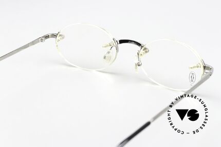 Cartier T-Eye Oval Titanium Frame Rimless, lens size (gliding lens) can be changed if needed, Made for Men and Women